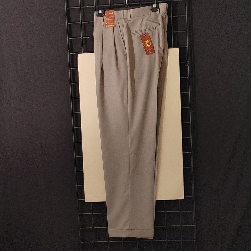 ST. PATRICK KHAKI POLY/ RAYON PLEATED DRESS SLACKS.